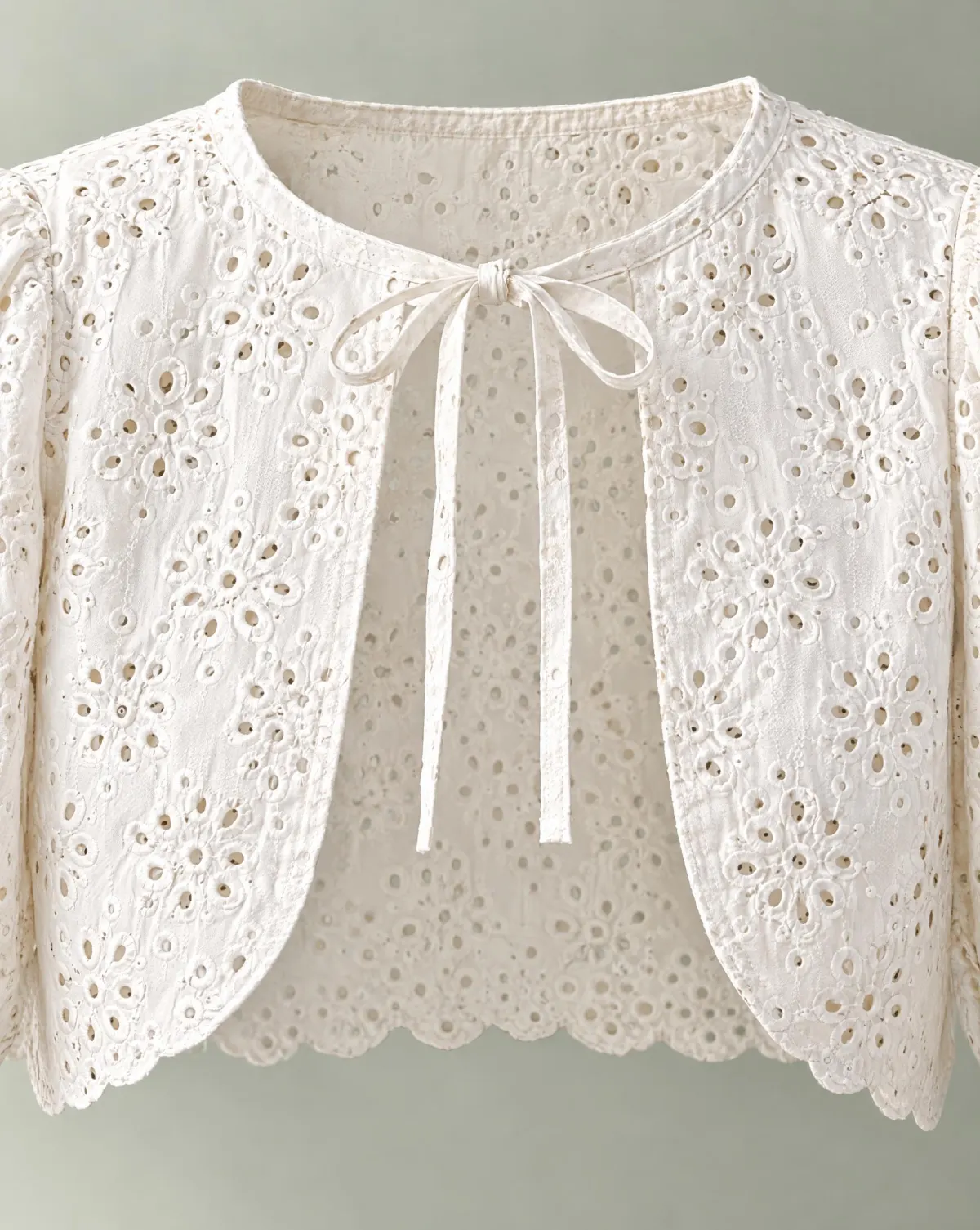 Close-up of the balloon-sleeve bolero embroidery and finishing