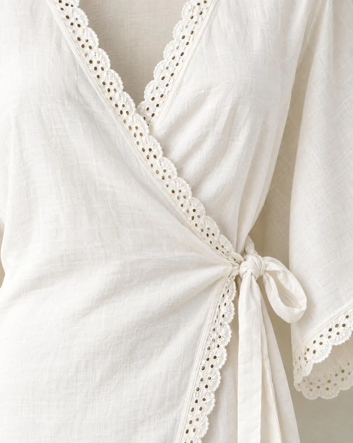 Close-up of the dapple wrap top embroidery and finishing