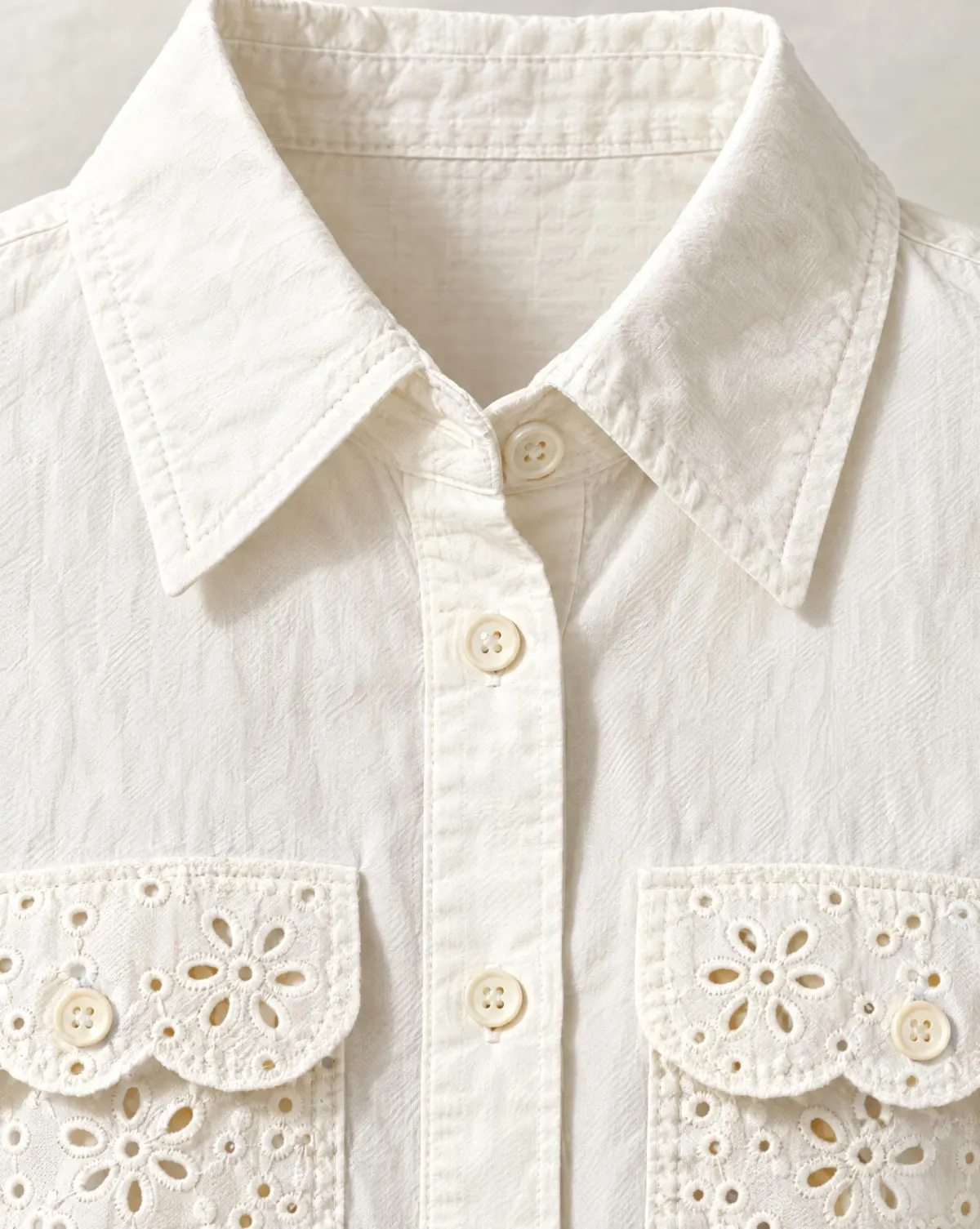 Close-up of the eyelet-pocket shirt jacket embroidery and finishing
