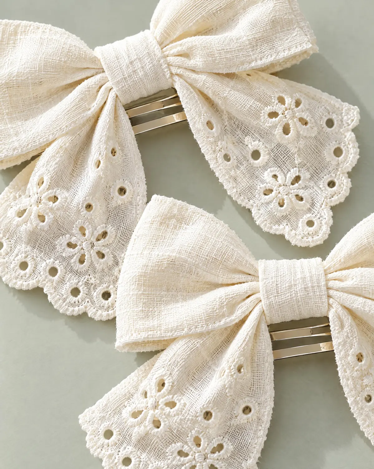 Close-up of the fabric bow clip pair embroidery and finishing