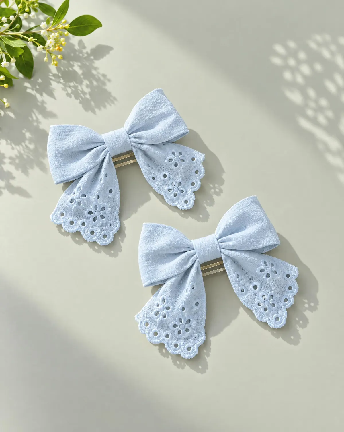 Fabric Bow Clip Pair in sky blue, front view