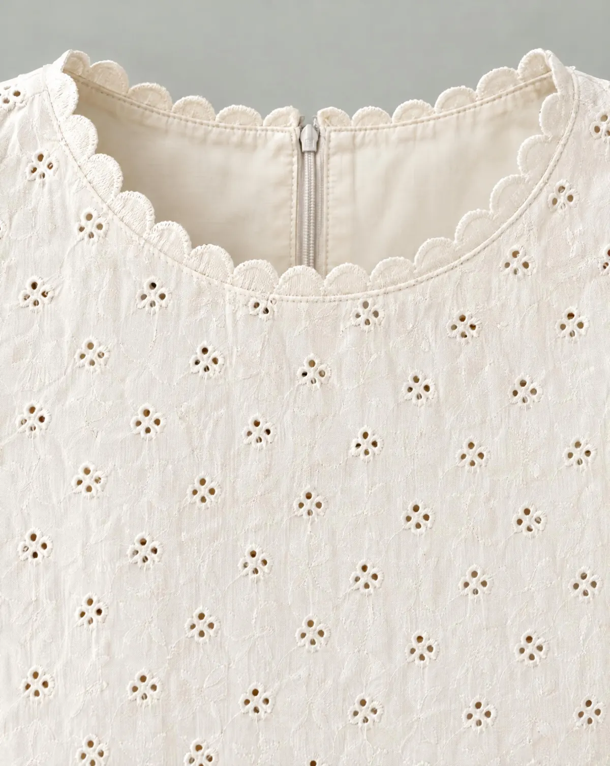 Close-up of the hedgerow scallop shell top embroidery and finishing