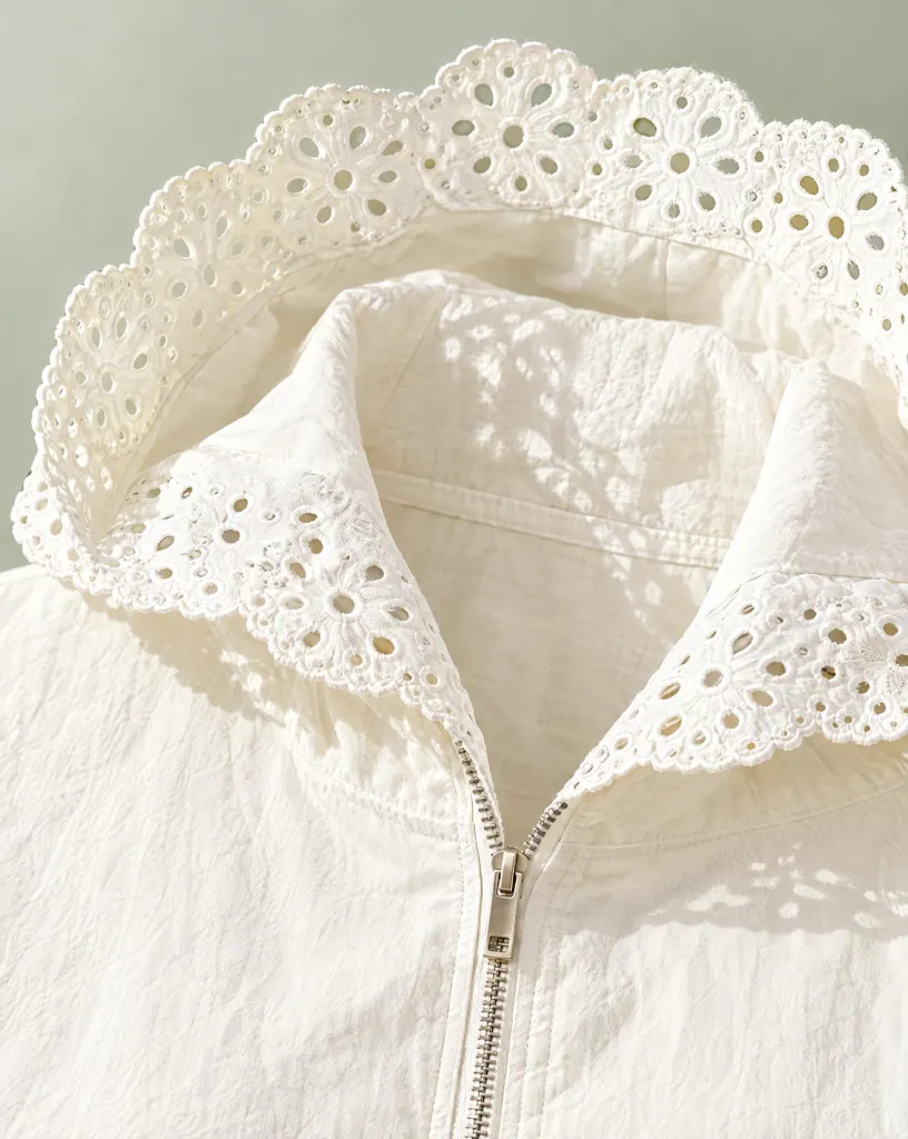 Close-up of the hooded garden layer embroidery and finishing
