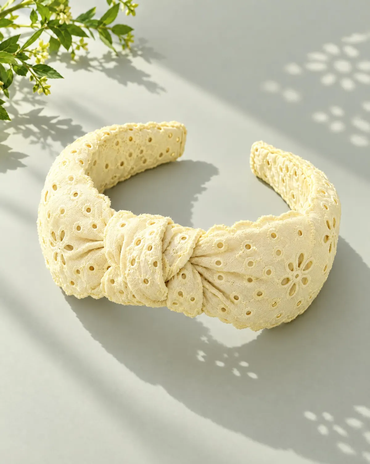 Knot Eyelet Headband in butter yellow, front view