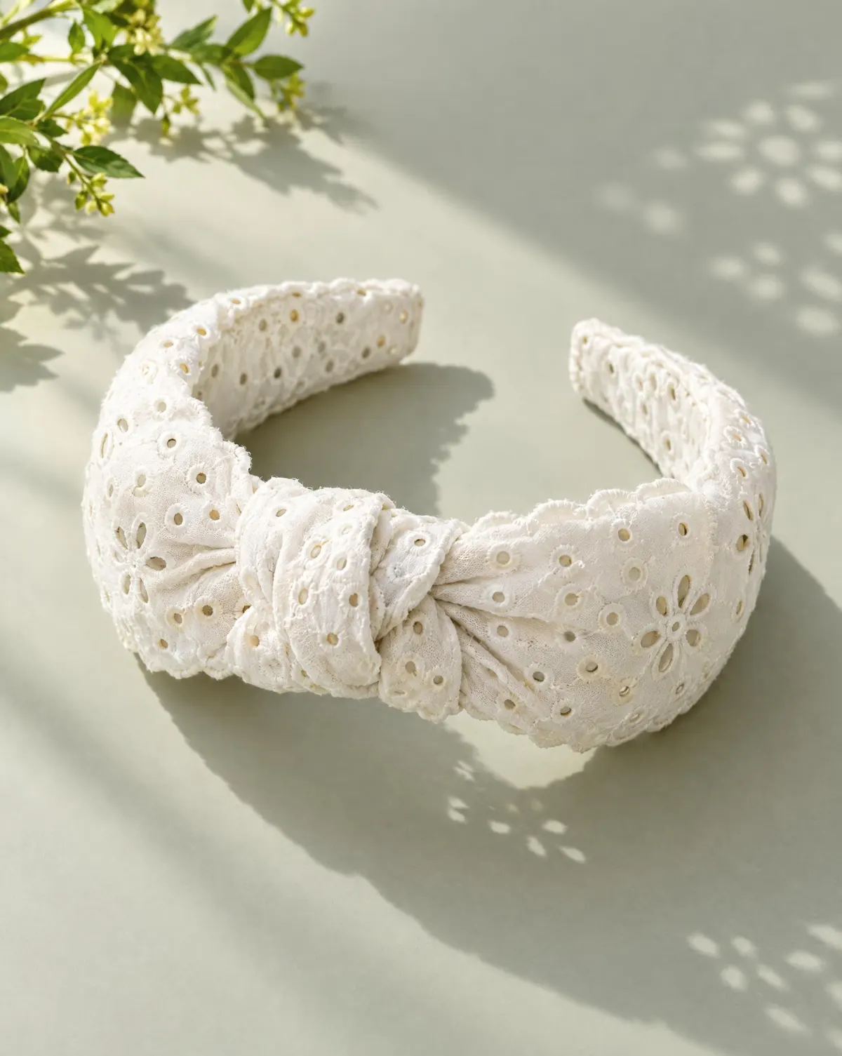 Knot Eyelet Headband in white, front view