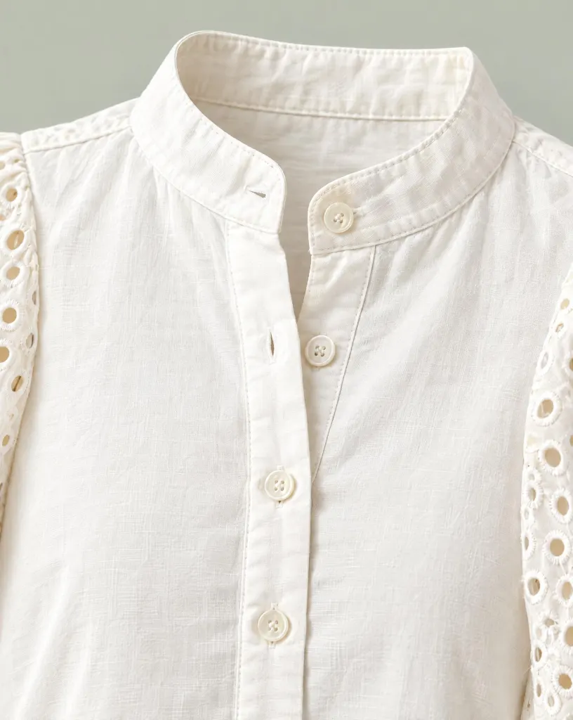 Close-up of the lantern-sleeve stand-collar blouse embroidery and finishing