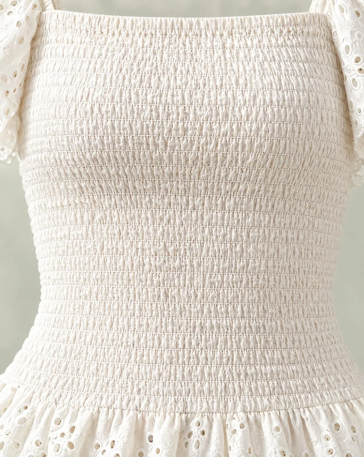 Close-up of the lattice smocked top embroidery and finishing