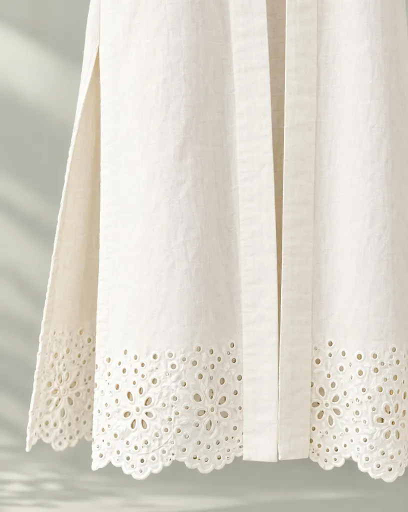 Close-up of the long duster layer embroidery and finishing