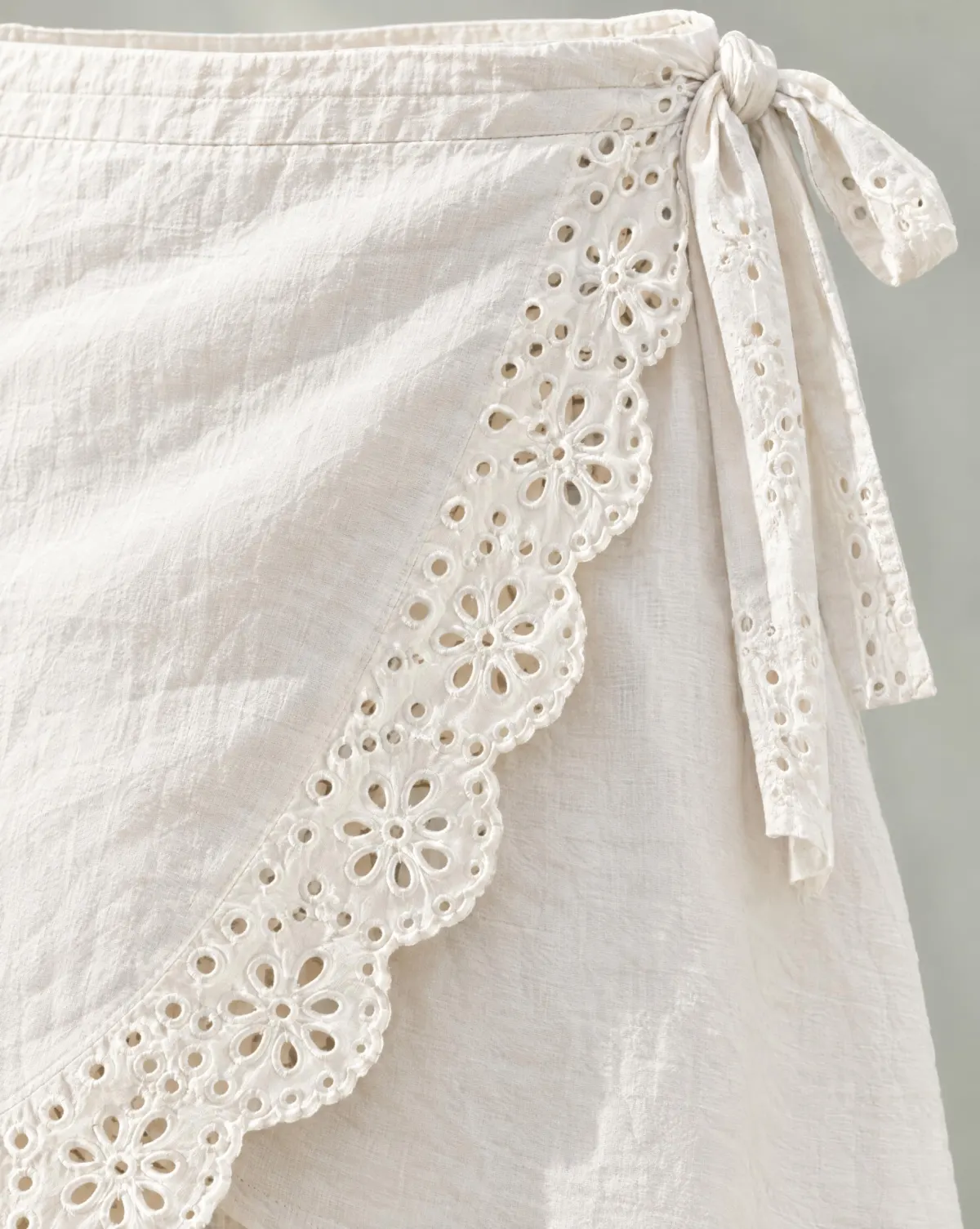 Close-up of the petal wrap mini skirt embroidery and finishing