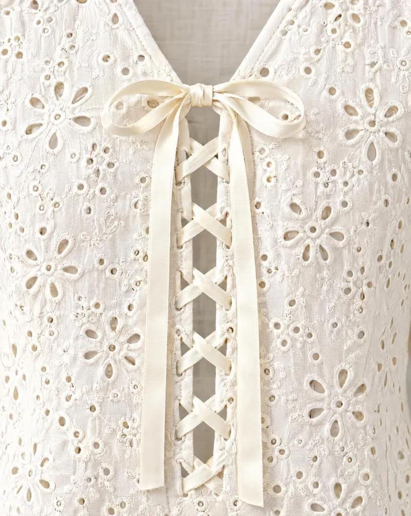 Close-up of the ribbon lace-up blouse embroidery and finishing