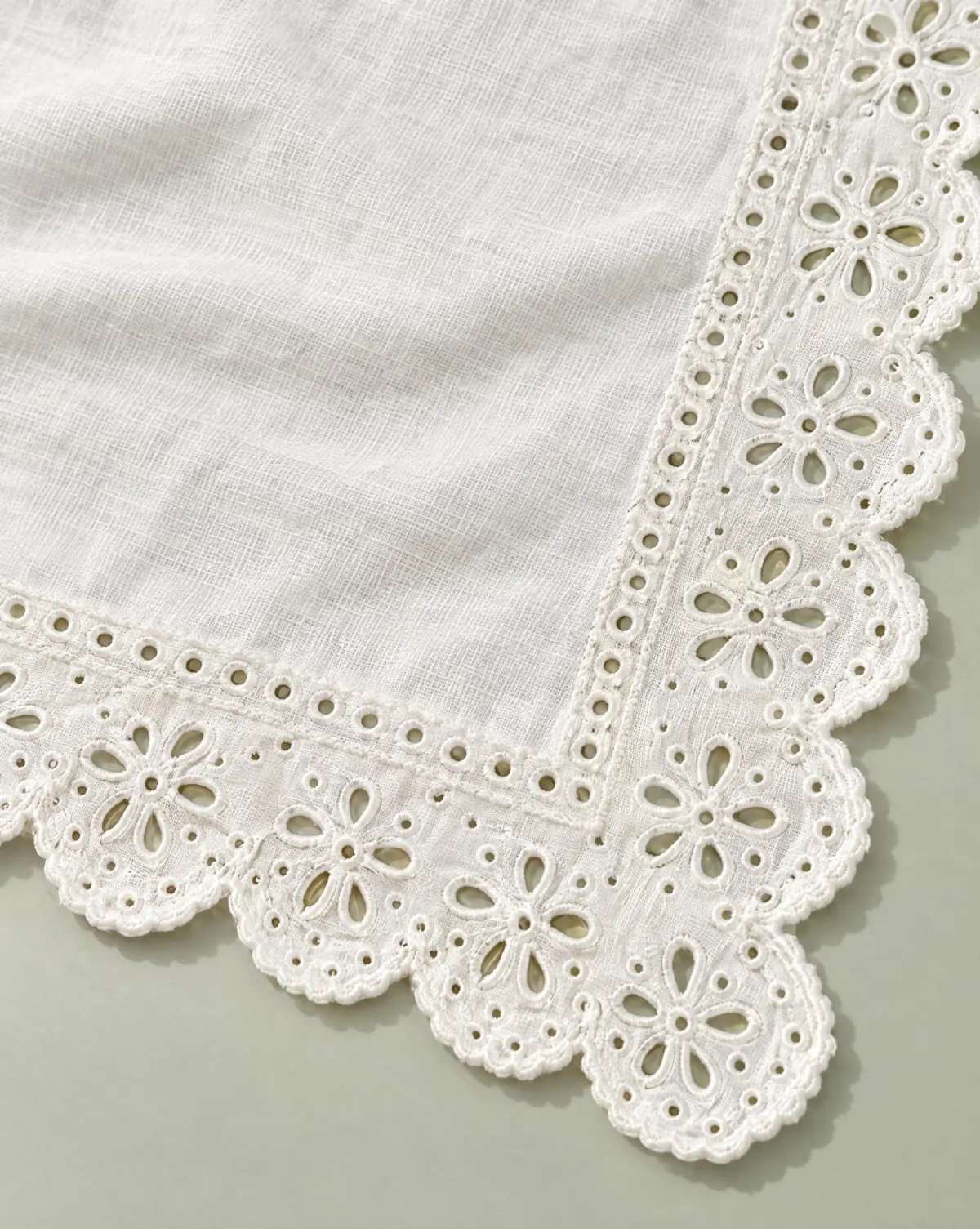 Close-up of the scallop hair scarf embroidery and finishing