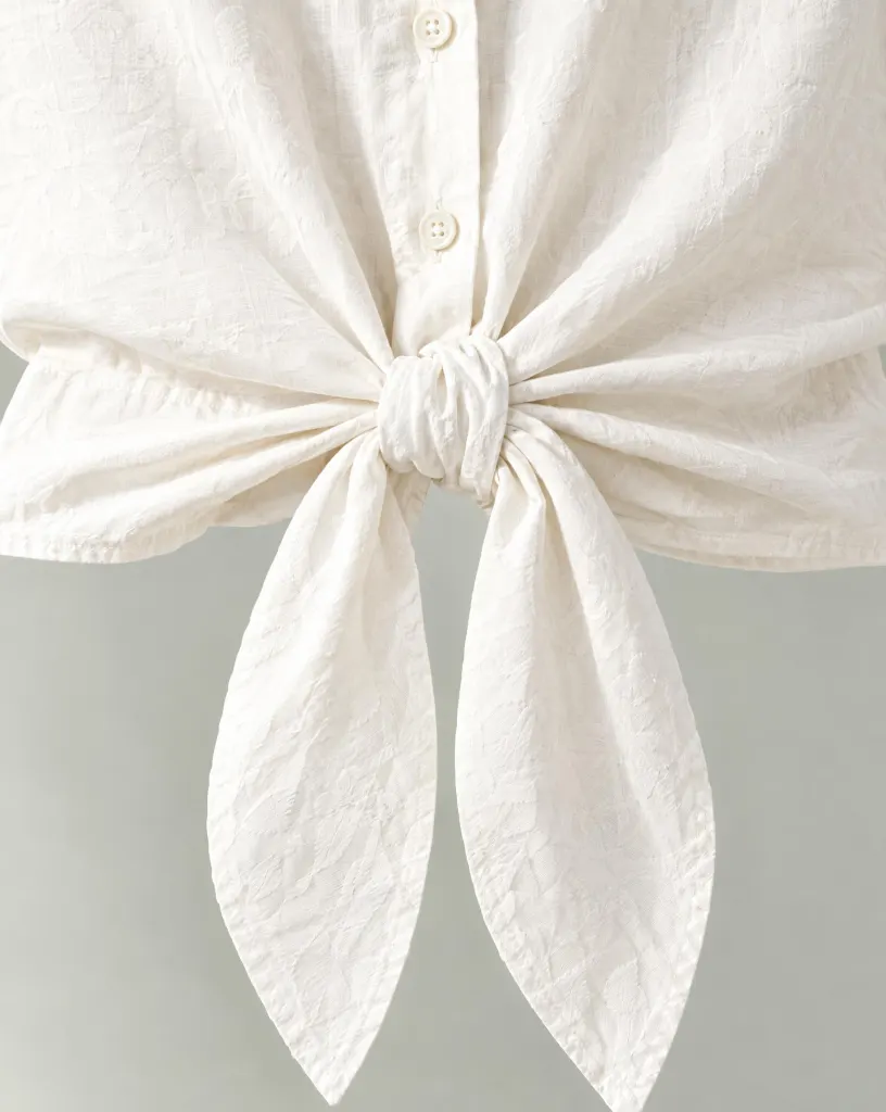 Close-up of the tie-front short overshirt embroidery and finishing